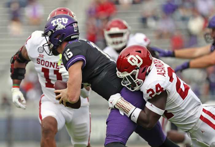 Oklahoma linebacker Brian Asamoah (24) tackles TCU quarterback Max Duggan (15). Mandatory Credit: Kevin Jairaj-USA TODAY Sports